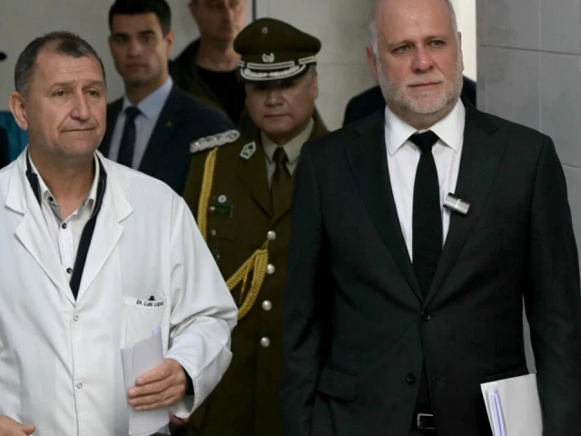chile s minister of the interior alvaro elizalde r visits a hospital in avellaneda argentina where two chilean men gravely injured in a football brawl are receiving treatment