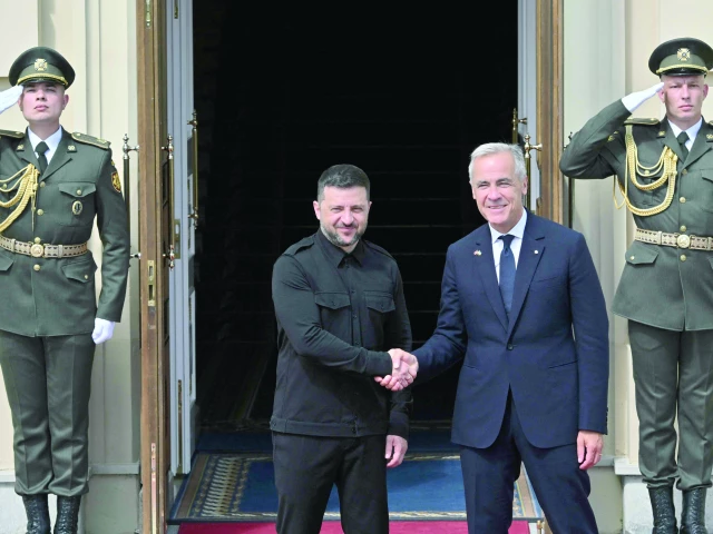ukrainian president volodymyr zelensky shakes hands prime minister of canada mark carney during their meeting prior the talks in kyiv photo afp