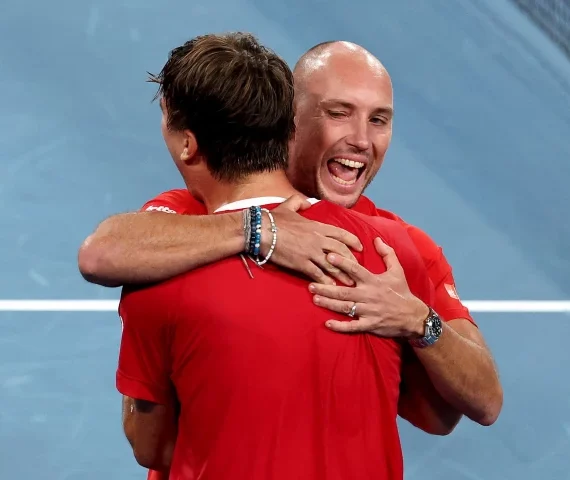 belgium s raphael collignon l celebrates with team captain steve darcis after defeating australia s alek vukic during the davis cup second round qualifier photo afp