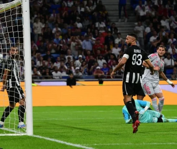 american midfielder tanner tessmann right scores the decisive goal for lyon against angers at the groupama stadium photo afp