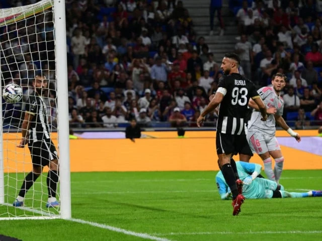 american midfielder tanner tessmann right scores the decisive goal for lyon against angers at the groupama stadium photo afp