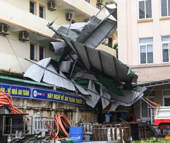 this picture shows a corrugated iron roof blown off after typhoon bualoi made a landfall in nghe an province on september 29 2025 vietnam said it evacuated almost 30 000 residents from coastal areas on september 28 as typhoon bualoi hit the country s steel producing central belt photo afp
