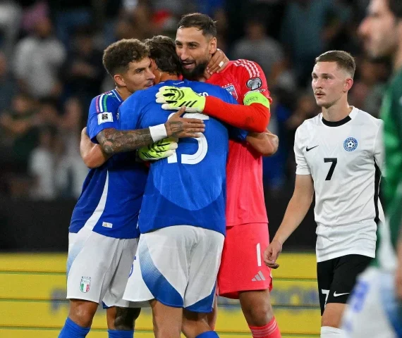 italy s goalkeeper 01 gianluigi donnarumma c italy s forward 15 pio esposito 2l and italy s defender 22 giovanni di lorenzo l embrace as they celebrate their team s victory at the end of the fifa world cup 2026 group i qualifiers photo afp