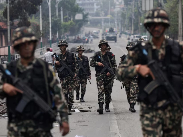 nepali army soldiers patrol at the road near the singha durbar office complex that houses the prime minister s office and other ministries following protests against monday s killing of 19 people after anti corruption protests triggered by a social media ban which was later lifted in kathmandu nepal september 10 2025 photo reuters