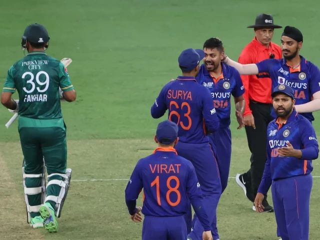 avesh khan celebrates with teammates after dismissing fakhar zaman during the asia cup 2022 photo afp