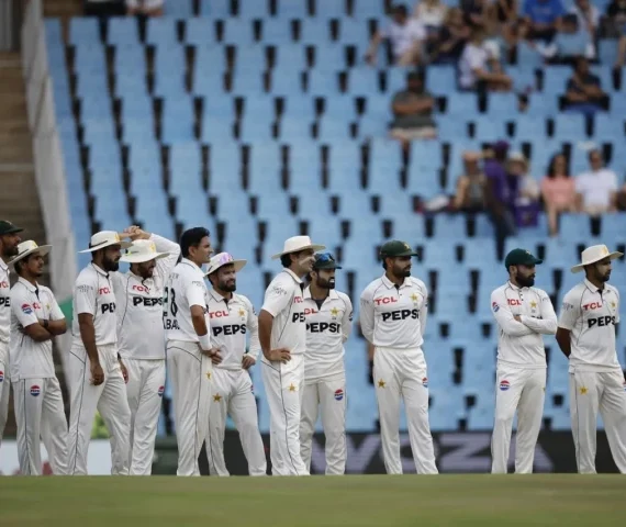 pakistan players gather on the field during a test match against south africa photo afp