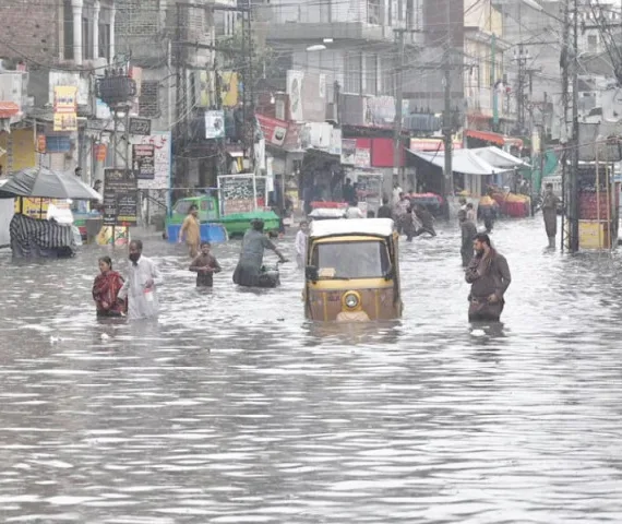 citizens navigate an inundated road in raja bazaar following heavy early morning downpour in the twin cities photos app inp