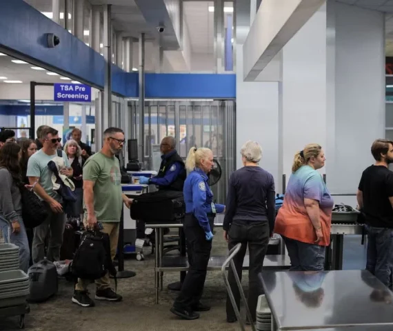 travelers pass through a transportation security administration tsa security screening at hollywood burbank airport during the first day of a partial us government shutdown in burbank california u s october 1 2025 photo reuters