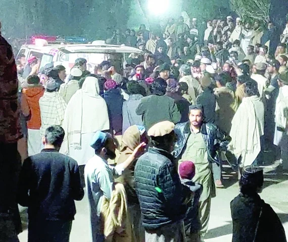people gather near an ambulance outside a hospital in bannu photo reuters