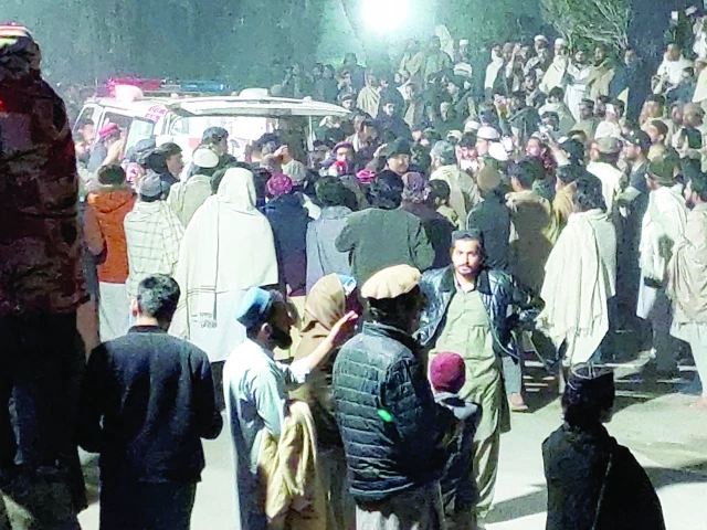 people gather near an ambulance outside a hospital in bannu photo reuters